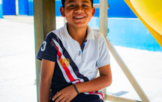middle school aged Sponsorship Child smiling at playground